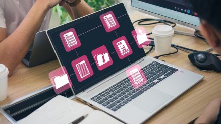 A photo showing an open laptop with folders open.