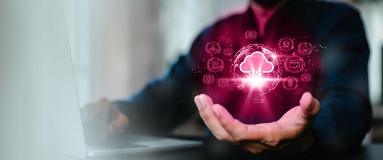 A male hand on which you can see a digital cloud.